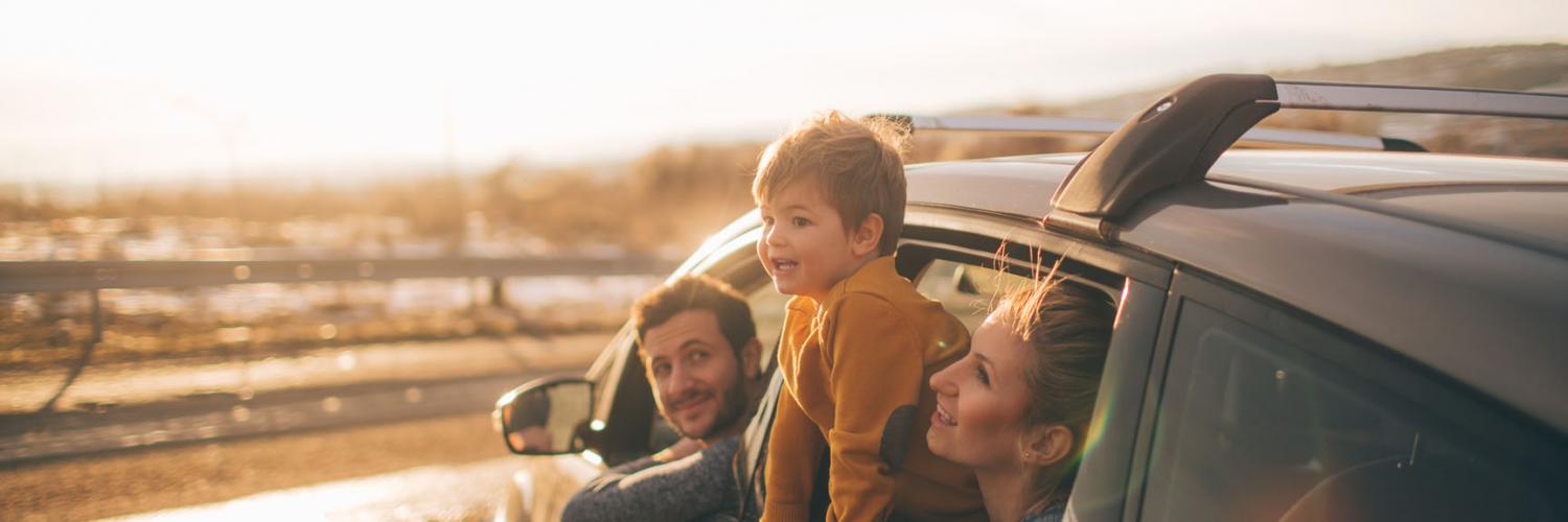 An image of a family in their car