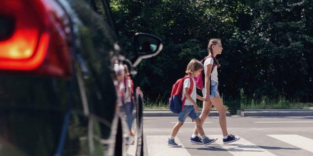 children walking on zebra crossing