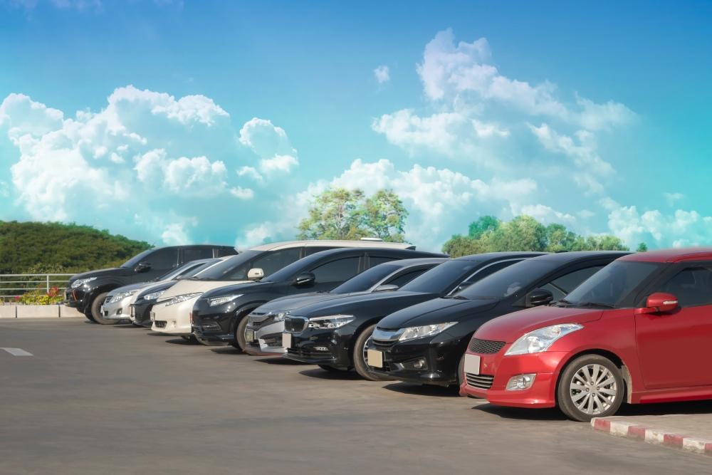 Parked cars under blue sky