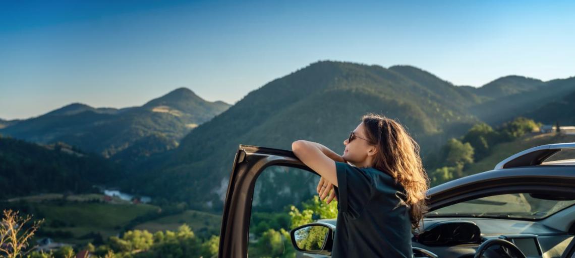 Woman by car door